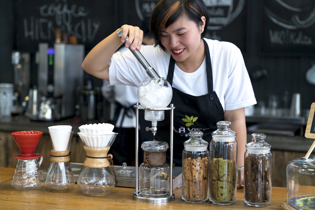 Woman Preparing Ice Cream in Bar